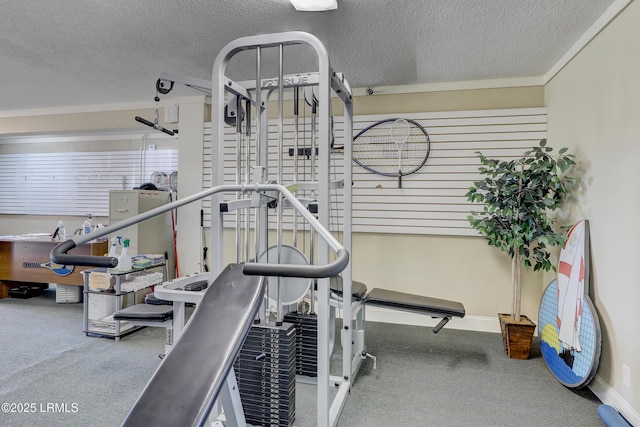 gym featuring a textured ceiling and carpet