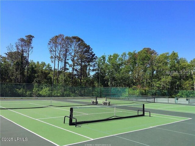 view of tennis court featuring basketball court