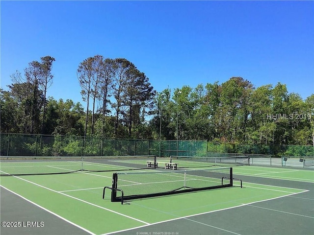 view of sport court featuring basketball hoop