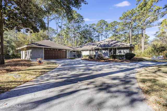 ranch-style house featuring a garage