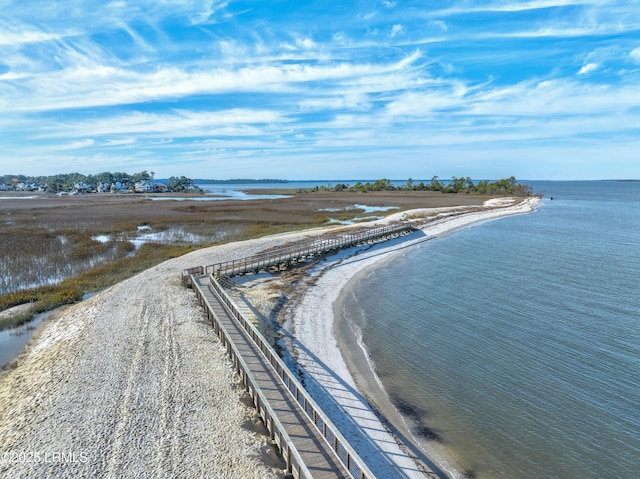 drone / aerial view featuring a view of the beach and a water view