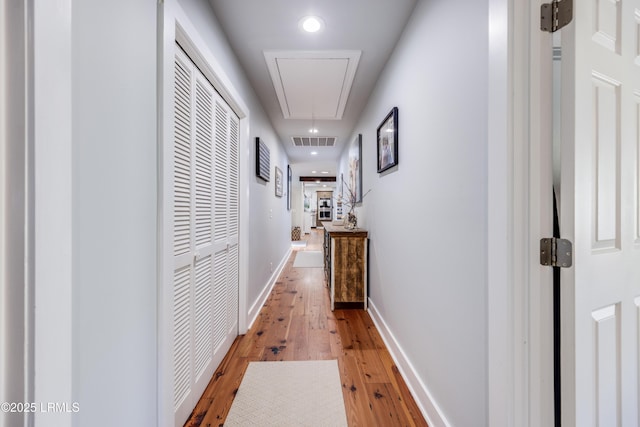 hall featuring hardwood / wood-style floors