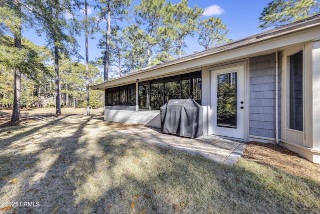 exterior space with a patio area and a lawn