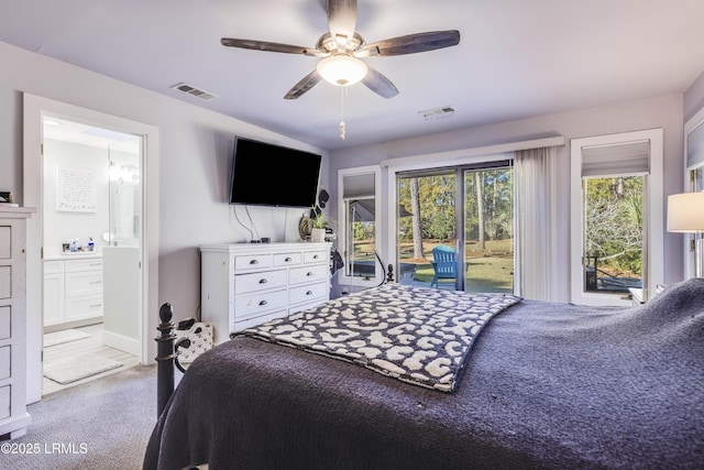 bedroom featuring ceiling fan, light colored carpet, access to exterior, and ensuite bath