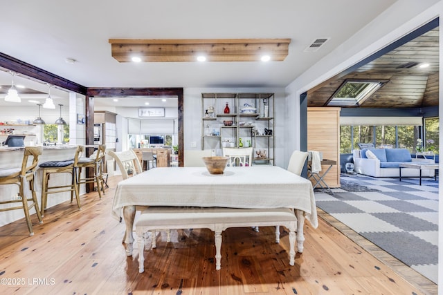 dining area with light hardwood / wood-style flooring