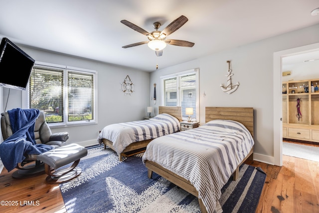 bedroom with hardwood / wood-style flooring and ceiling fan