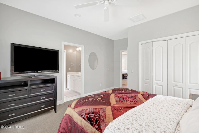 carpeted bedroom with ensuite bath, ceiling fan, and a closet