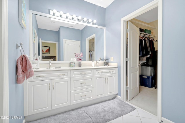 bathroom with tile patterned flooring and vanity