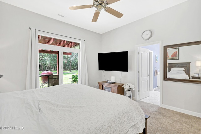 carpeted bedroom with connected bathroom and ceiling fan