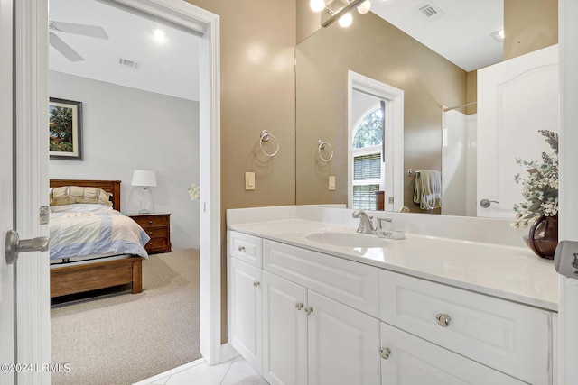 bathroom featuring vanity, tile patterned floors, and ceiling fan