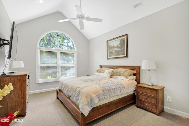 bedroom featuring ceiling fan, lofted ceiling, and light carpet