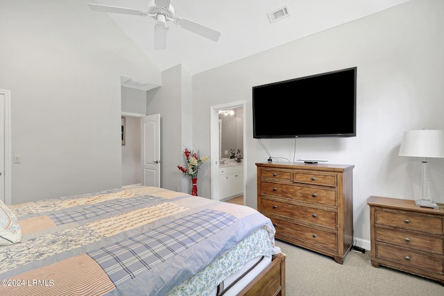 carpeted bedroom featuring lofted ceiling, ensuite bath, and ceiling fan