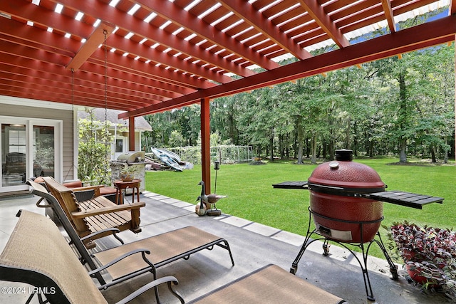 view of patio featuring area for grilling and a pergola