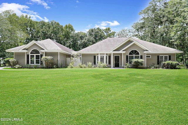 ranch-style home with a front yard