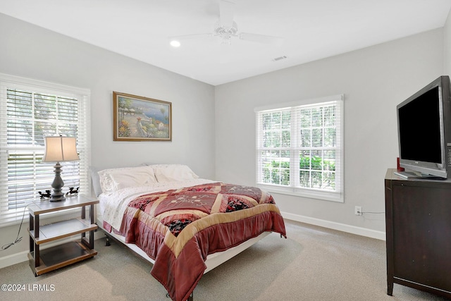 carpeted bedroom featuring ceiling fan