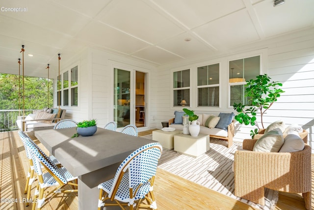 wooden terrace featuring outdoor lounge area