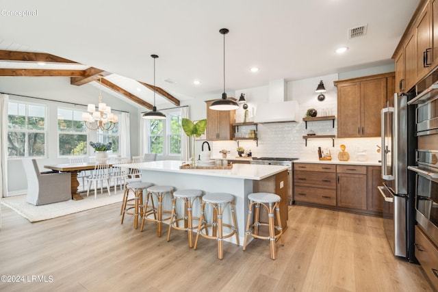 kitchen with open shelves, light countertops, light wood-type flooring, premium range hood, and brown cabinetry