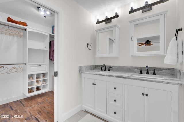 bathroom with vanity and hardwood / wood-style floors