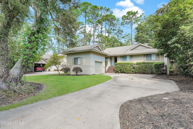 ranch-style house featuring a carport and a front yard