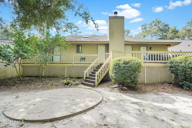 rear view of property with a patio area and a deck