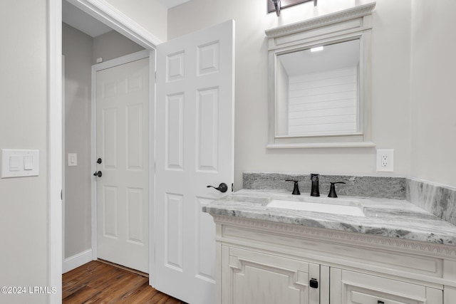 bathroom featuring vanity and wood-type flooring