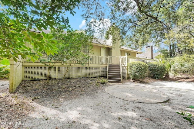 rear view of property with a deck