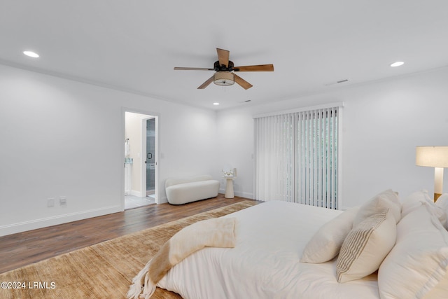 bedroom featuring hardwood / wood-style floors, ornamental molding, ceiling fan, and ensuite bathroom