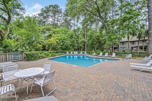 view of pool featuring a patio area