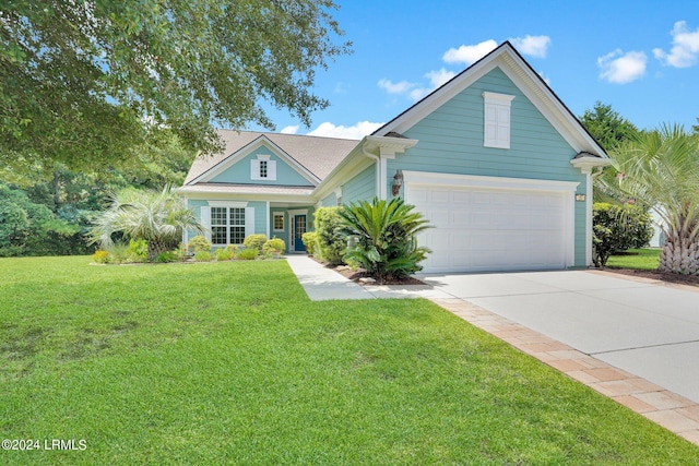 view of front of house featuring a garage and a front yard