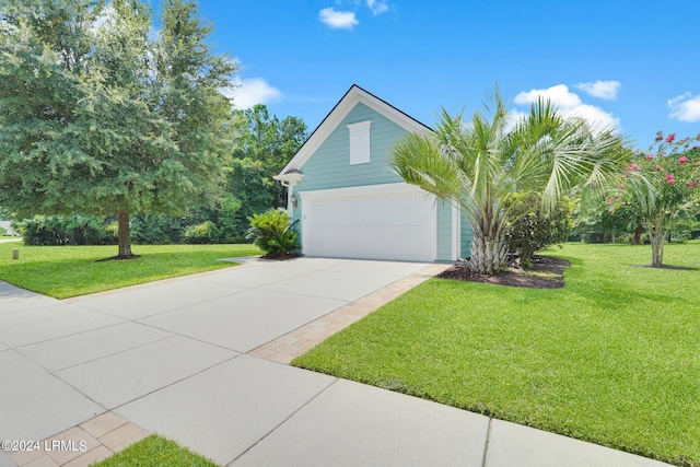 exterior space featuring a yard and concrete driveway