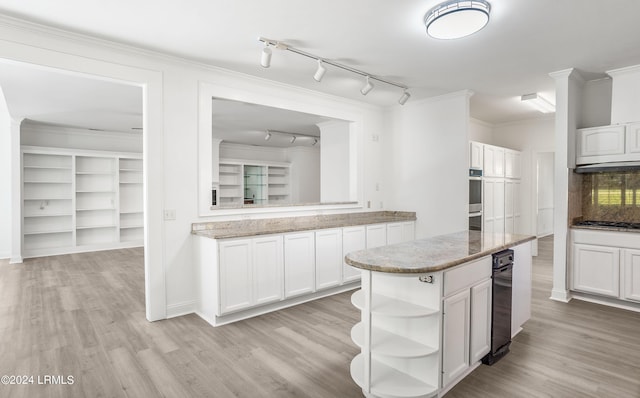 kitchen featuring tasteful backsplash, ornamental molding, white cabinets, and a kitchen island