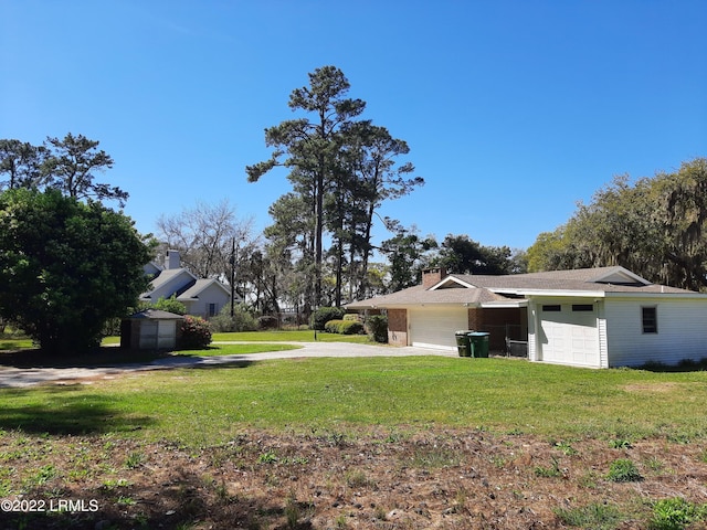 view of yard featuring a garage