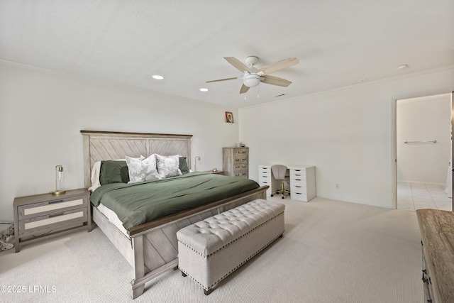 carpeted bedroom featuring recessed lighting, a ceiling fan, and crown molding