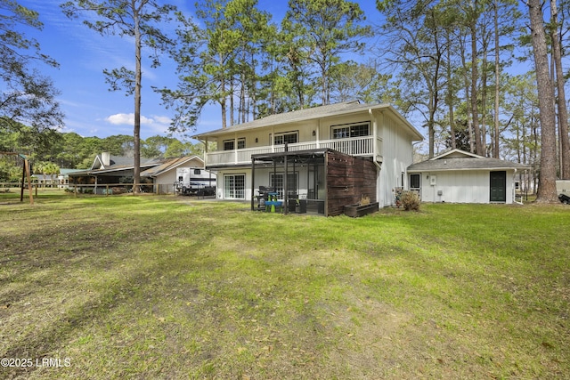 rear view of property featuring a lawn