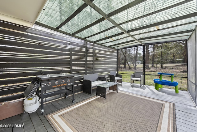 wooden terrace with an outdoor hangout area and a lanai