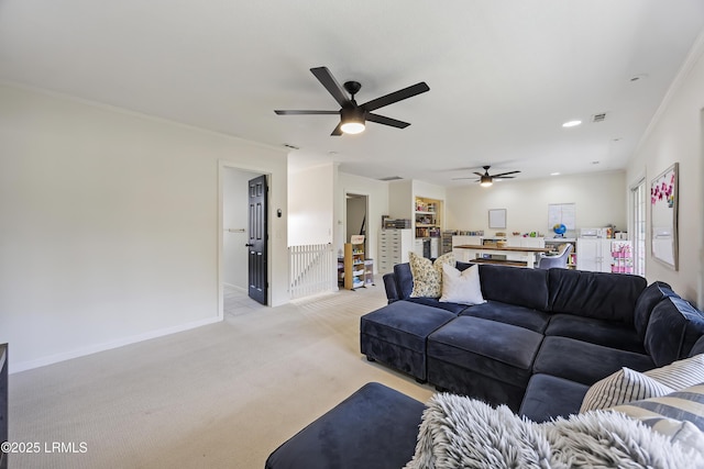 living area featuring light carpet, visible vents, ornamental molding, and baseboards