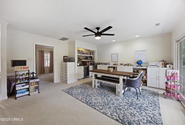 dining space featuring recessed lighting, light colored carpet, visible vents, and crown molding