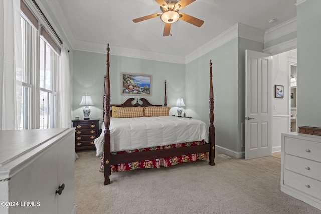 bedroom with light carpet, ornamental molding, and ceiling fan