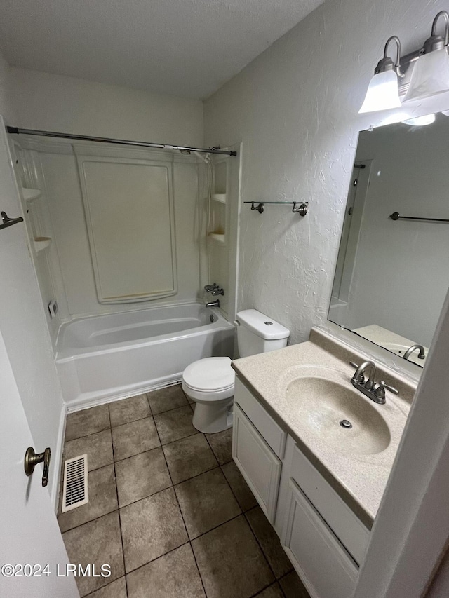 full bathroom featuring vanity, tile patterned flooring, bathing tub / shower combination, and toilet