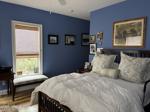 bedroom featuring ceiling fan and wood finished floors