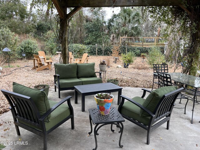 view of patio featuring outdoor dining area and an outdoor hangout area