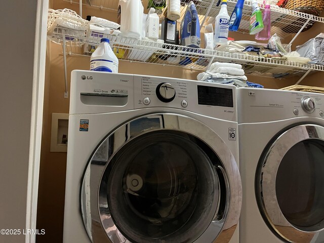 washroom featuring washer and dryer