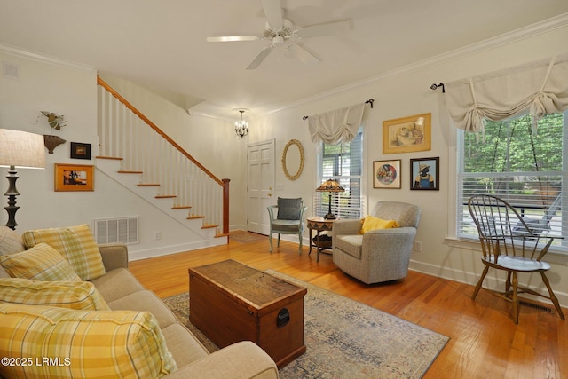 19 Brisbane Dr, Beaufort, SC 29902 - living area with stairs, visible vents, ornamental molding, and wood finished floors