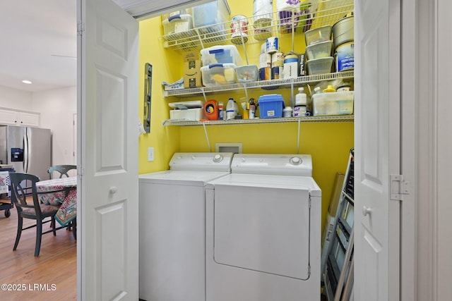 19 Brisbane Dr, Beaufort, SC 29902 - laundry room with light wood-style flooring, washing machine and dryer, and laundry area