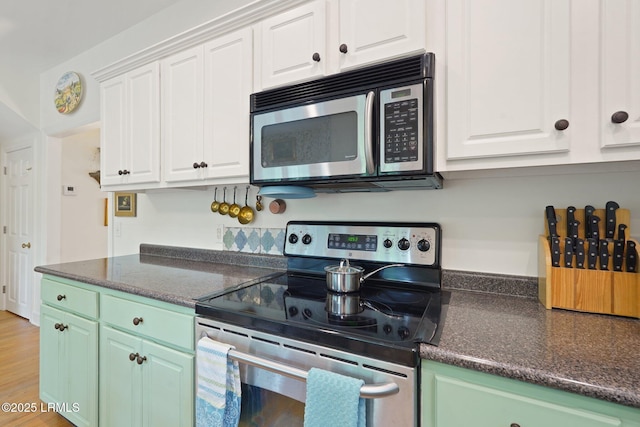 19 Brisbane Dr, Beaufort, SC 29902 - kitchen featuring light wood-style floors, white cabinetry, and appliances with stainless steel finishes