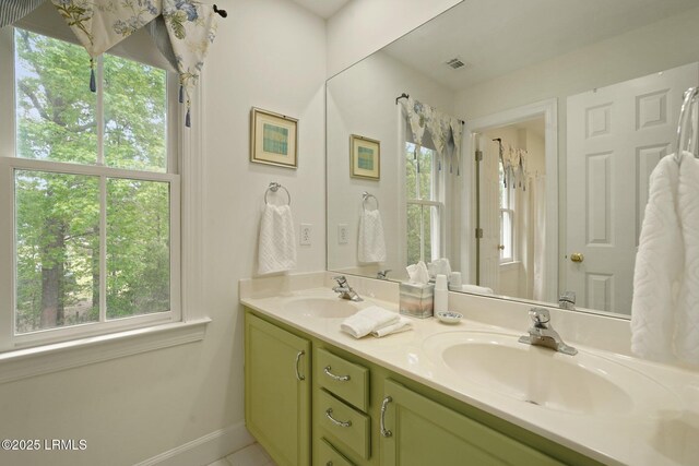 19 Brisbane Dr, Beaufort, SC 29902 - full bath with baseboards, double vanity, a sink, and visible vents