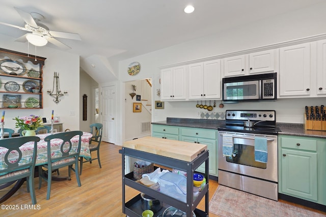 19 Brisbane Dr, Beaufort, SC 29902 - kitchen featuring ceiling fan, dark countertops, white cabinetry, light wood finished floors, and stainless steel appliances