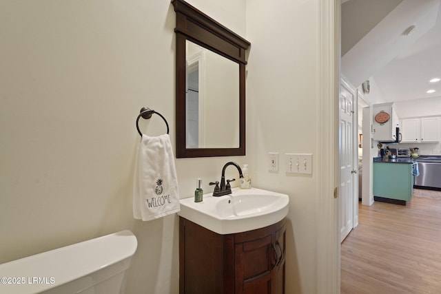 19 Brisbane Dr, Beaufort, SC 29902 - bathroom with wood finished floors, vanity, and recessed lighting