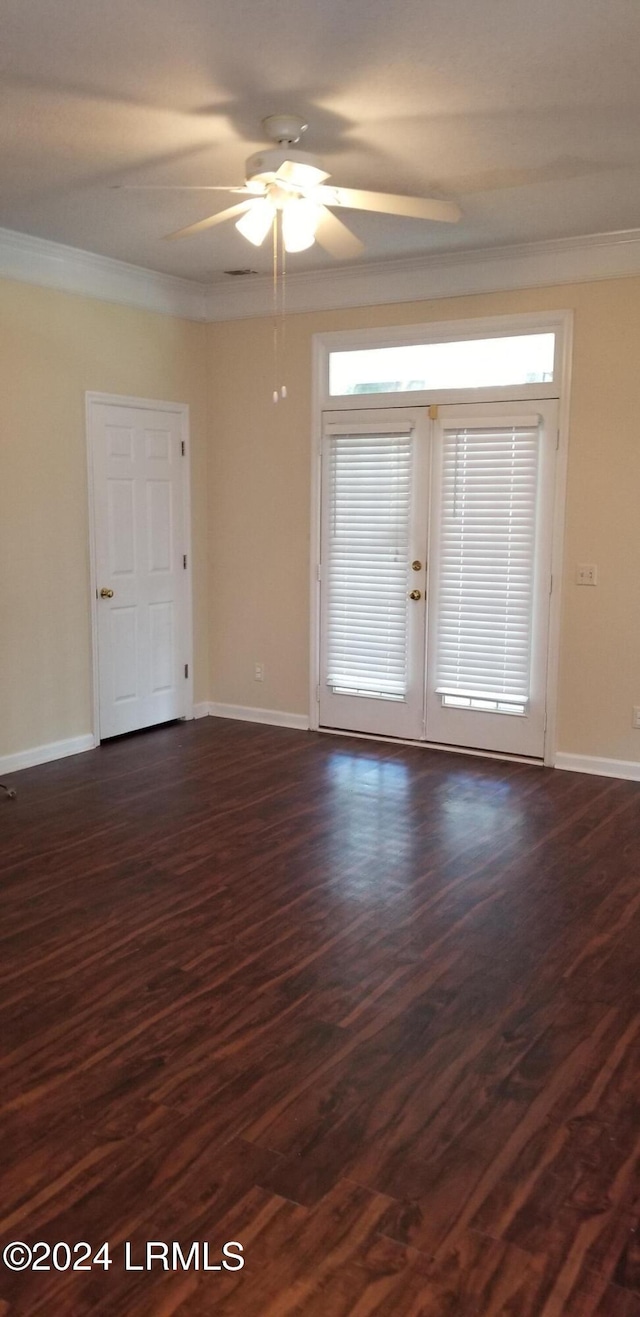 spare room with ornamental molding, dark hardwood / wood-style floors, and ceiling fan