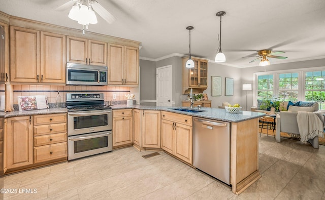 21 Planters Cir, Beaufort, SC 29907 - kitchen featuring appliances with stainless steel finishes, ceiling fan, light brown cabinets, a peninsula, and tasteful backsplash